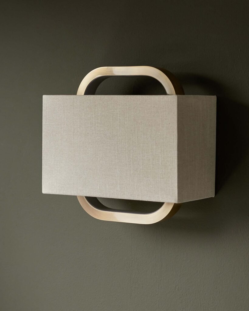 Sanza natural linen and Dusk brushed bronze wall light Front
