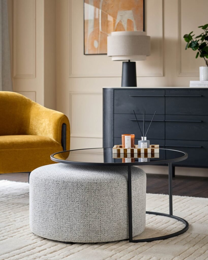 Thea smoked mirror coffee table and light grey fabric pouffe set – Dusk England Front